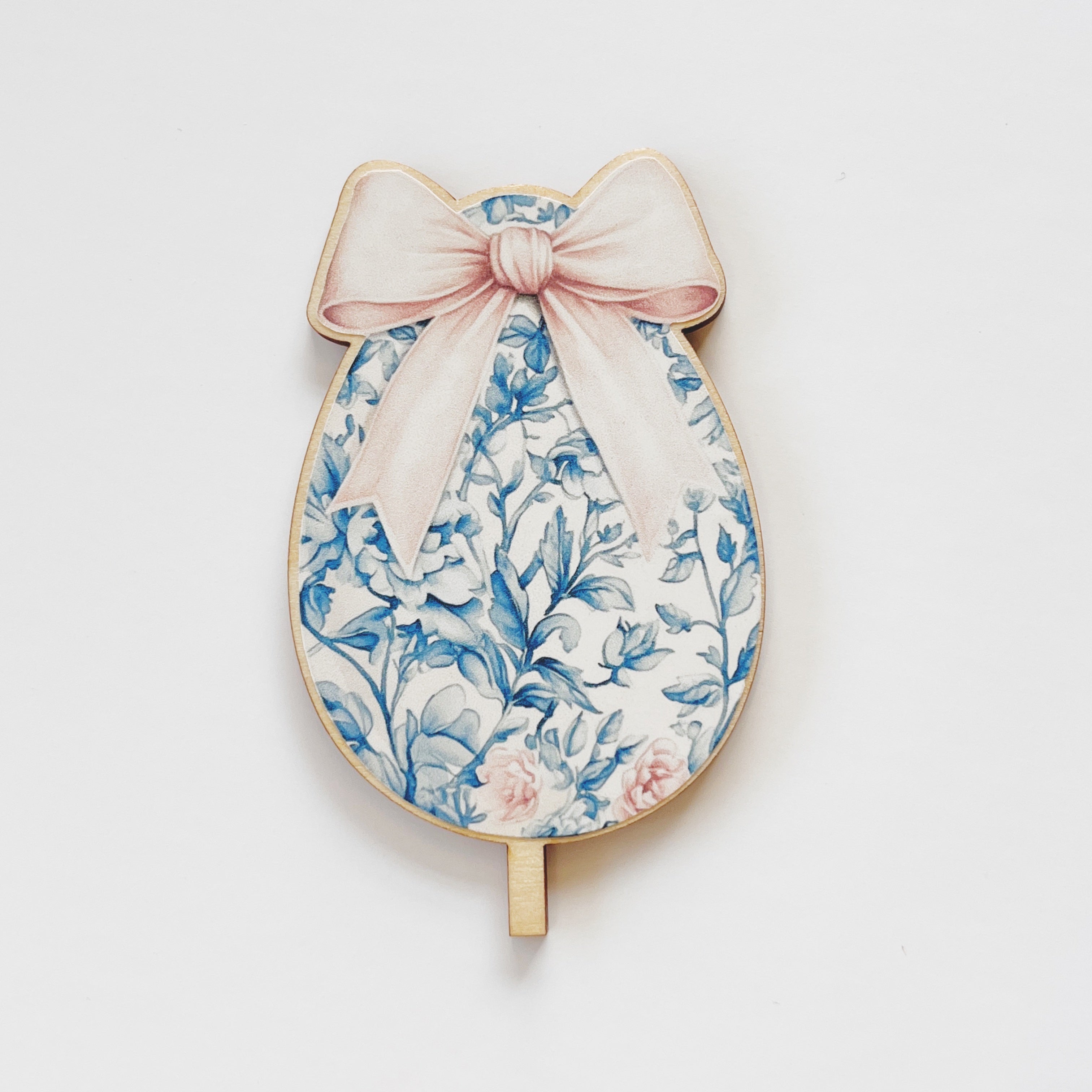 Motivstecker Ei blau mit rosa Schleife und Delf Muster